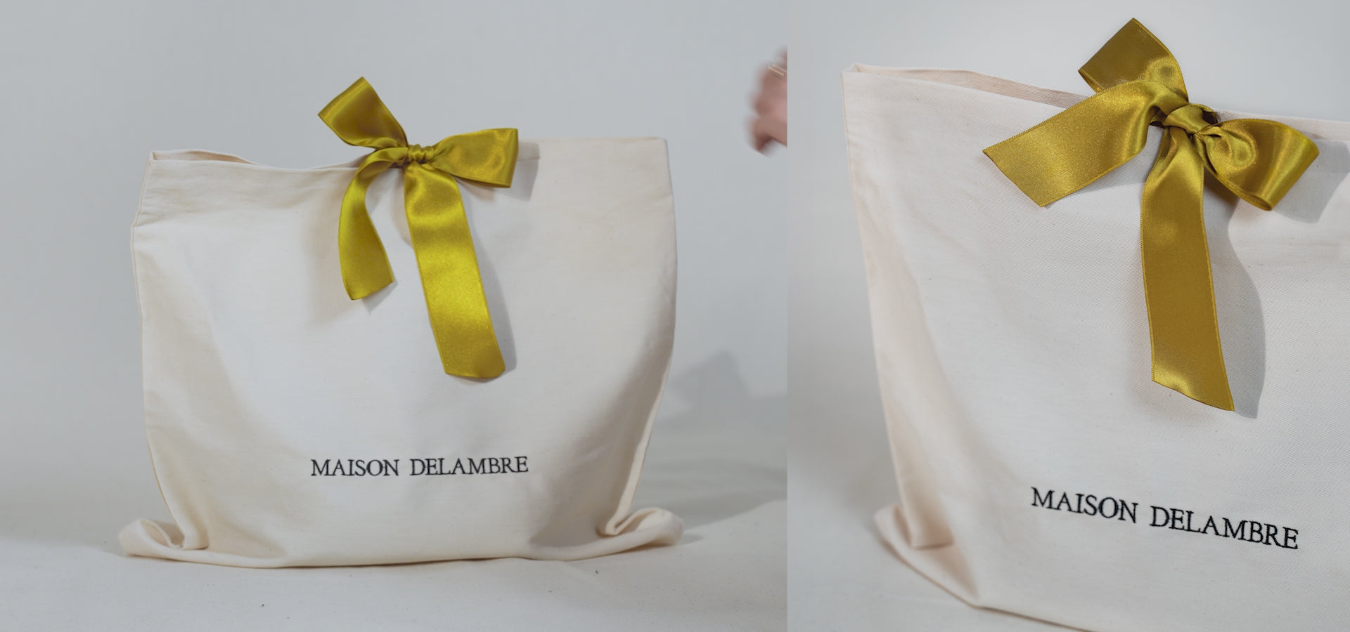 vidéo emballage cadeau de sac à main en tissu neige avec broderie noir Maison Delambre et noeud de soie camel